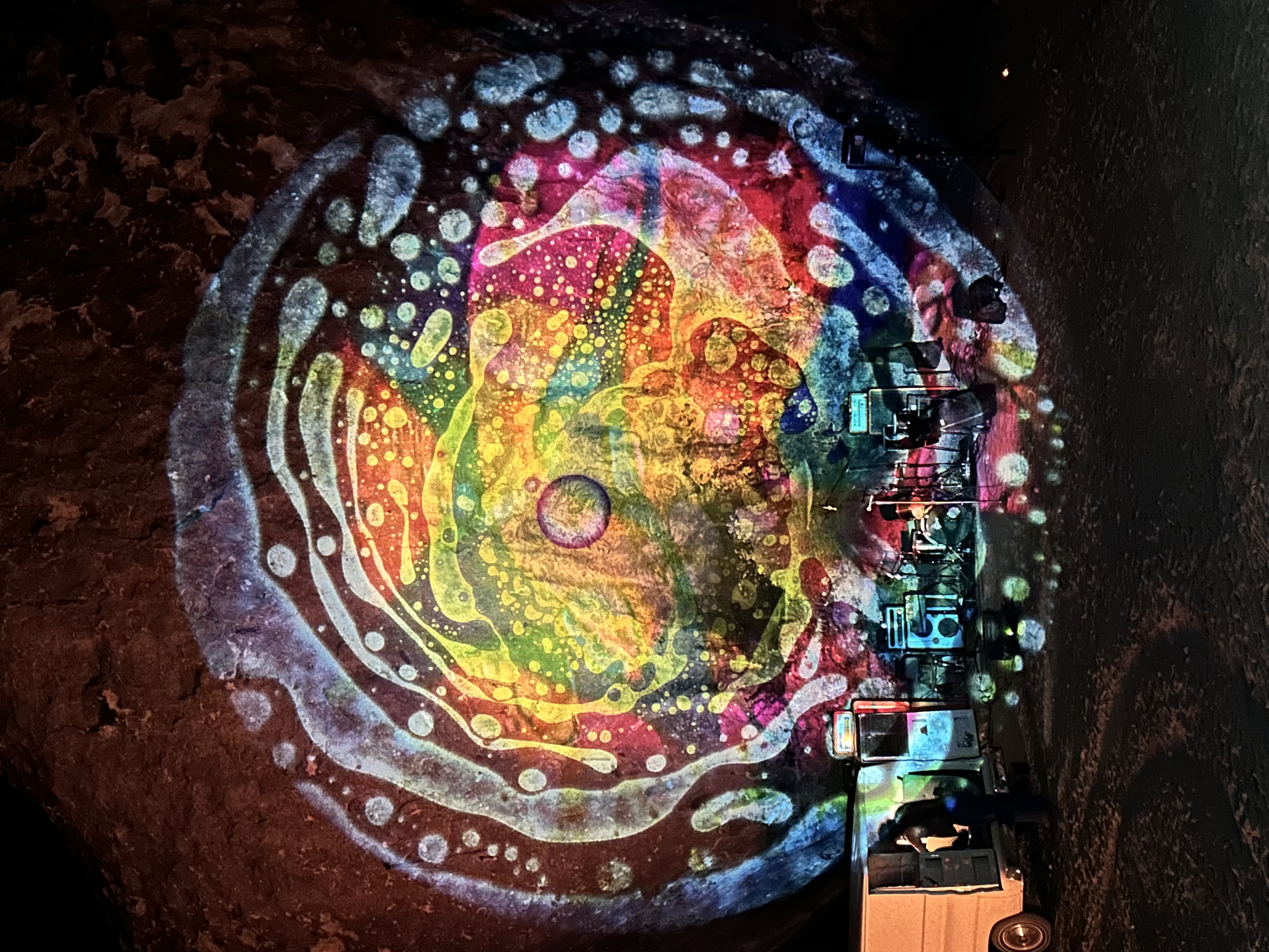 Close-up of hands manipulating liquid on projector